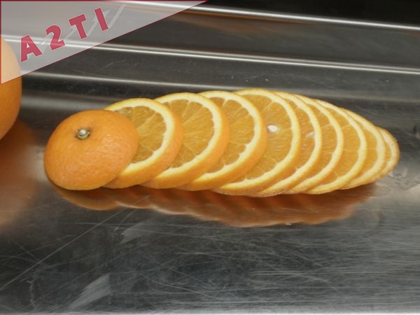 Coupeuse d'oranges en rondelles